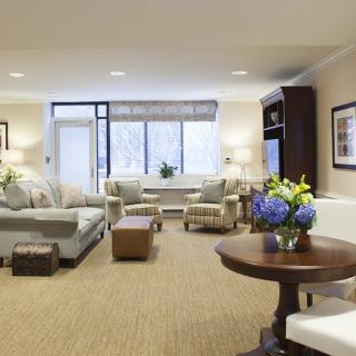 A spacious and elegantly decorated living room with comfortable seating and modern decor.