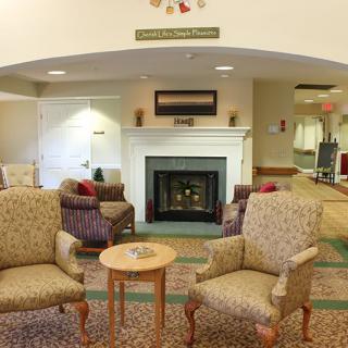 A cozy living room with comfortable seating and a fireplace.