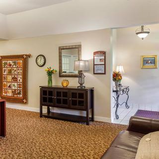 A cozy living room with a mix of classic decor and comfortable furnishings.