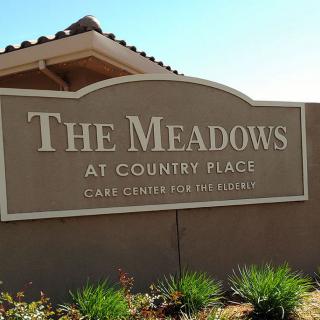 Entrance sign for The Meadows at Country Reach residential community.