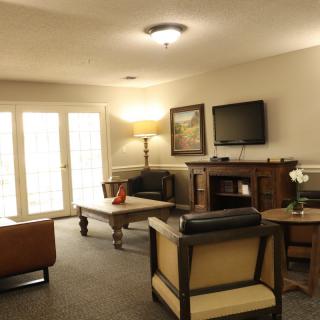 A cozy living room with comfortable seating and a warm ambiance.