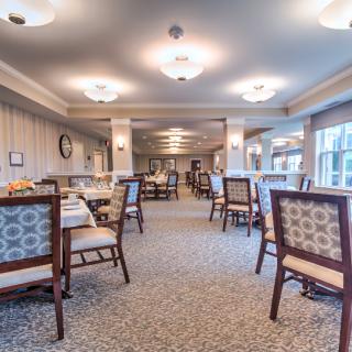 Spacious dining area with elegant furnishings and ambient lighting.