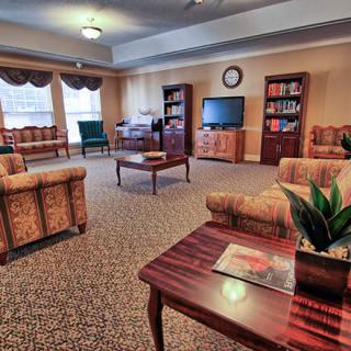 A cozy living room with comfortable seating and a television.