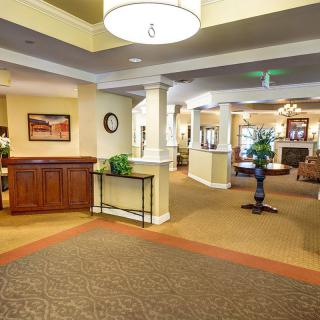 A spacious and elegantly decorated reception area with modern furnishings.