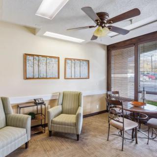 A comfortable waiting room with seating and natural light.