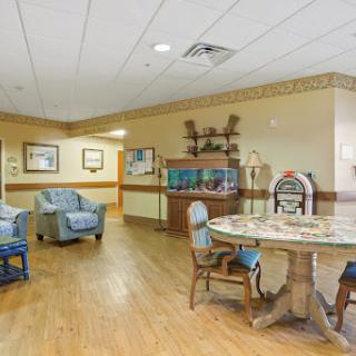 A cozy lounge area featuring comfortable seating and a dining table, ideal for gatherings and relaxation.