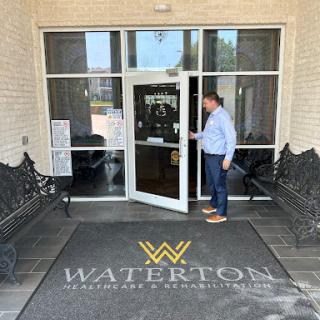 A man approaching the entrance of Waterton, ready to enter.