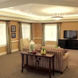 A cozy living room with a sofa, TV, and decorative elements.