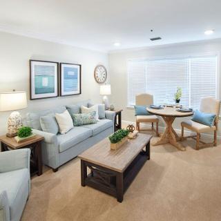 A modern living room with comfortable seating and a cozy dining area.