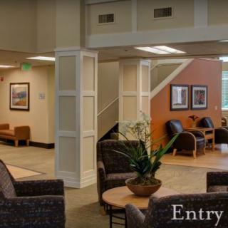 A comfortable lobby area with seating and decor.