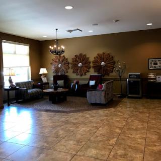 A warm and inviting living room setup featuring comfortable seating and stylish decor.