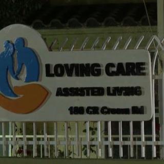 A sign for Loving Care Assisted Living facility with its logo and address: 180 CR Cremen Rd.
