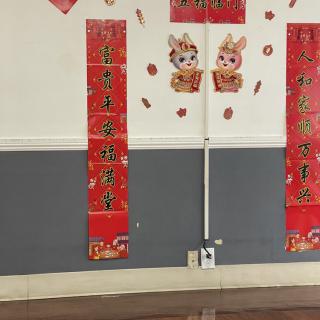 Wall decorated with Chinese New Year banners and rabbit illustrations.