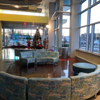 A cozy lobby space featuring modern seating arrangements and holiday decorations.