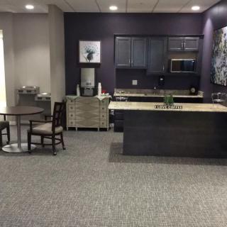 A modern kitchen interior with a dining area and contemporary furnishings.