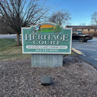 Welcome sign for Heritage Court, an apartment complex.