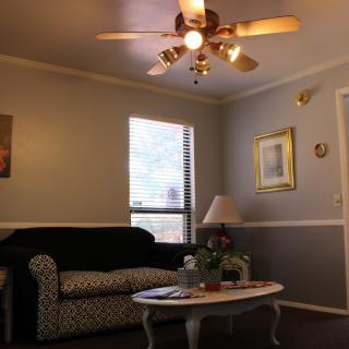 A cozy living room with comfortable seating and warm lighting.
