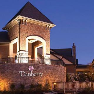 A well-lit brick building entrance at night.