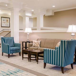 A cozy lobby area with comfortable seating and elegant decor.