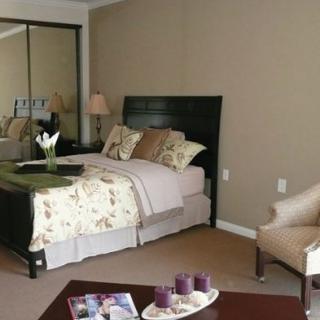 A cozy bedroom with modern decor and stylish furnishings.