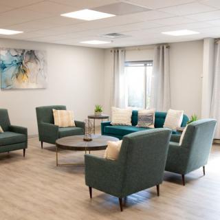 A modern waiting room with comfortable seating and contemporary decor.