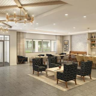 A modern lounge area with comfortable seating and elegant chandeliers.