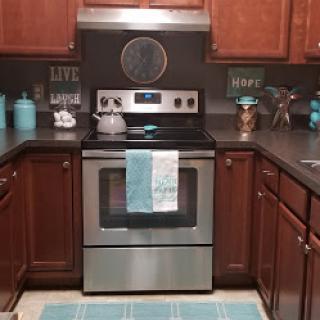 A beautifully organized kitchen featuring modern appliances and a charming decor.