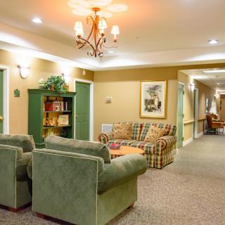 Cozy living room with comfortable seating and warm lighting.
