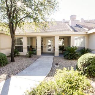A well-maintained residential property with a landscaped front yard.