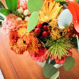 A vibrant bouquet of mixed flowers with diverse colors and textures.