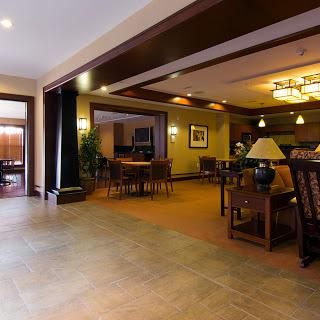 A spacious and inviting lobby area featuring comfortable seating and warm lighting.