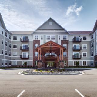 Modern residential building with a prominent entrance.