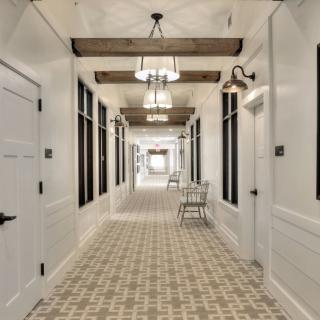 A modern hallway with elegant lighting and classic decor.