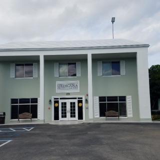 Front view of a two-story building with a business entrance.