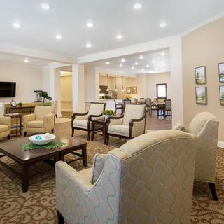 A spacious and elegantly designed living room with comfortable seating and modern decor.
