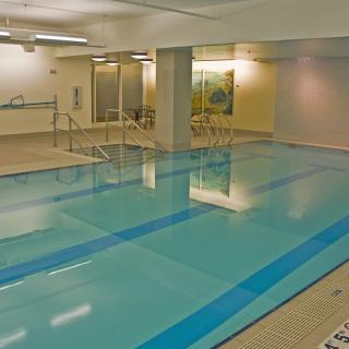 An indoor swimming pool in a fitness center.