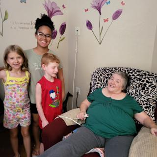 A joyful family moment with kids and their grandmother.