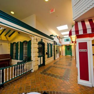 A vibrant indoor hallway designed to resemble a charming village street.