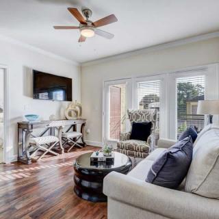 A modern living room with sleek furniture and abundant natural light.