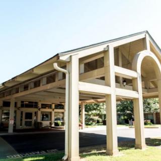 A modern building entrance featuring symmetrical architectural design.
