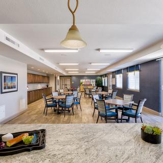 A spacious dining area with modern decor and ample seating arrangements.