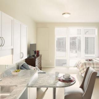 A bright, modern kitchen and dining area with an open layout.