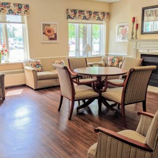 A cozy living room with comfortable seating and a wooden table.