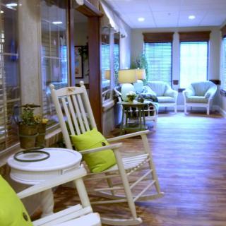A cozy lounge area with rocking chairs and soft cushions, perfect for relaxation.