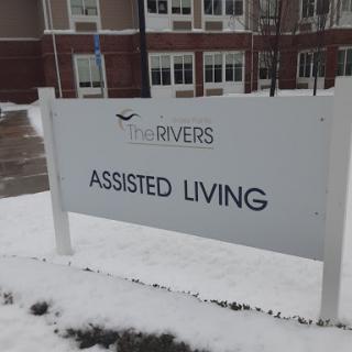Sign for an assisted living facility during winter.