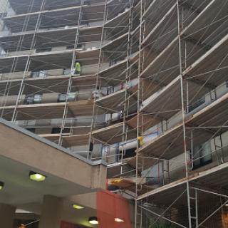 Scaffolding set up around a building undergoing renovation.