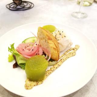 An artfully presented gourmet seafood dish featuring fresh ingredients and vibrant colors.
