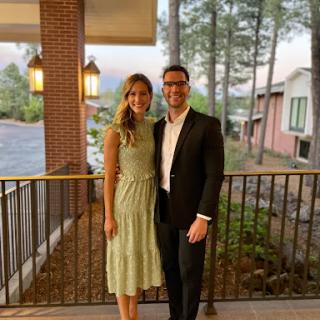 A lovely couple enjoying a beautiful evening outdoors.