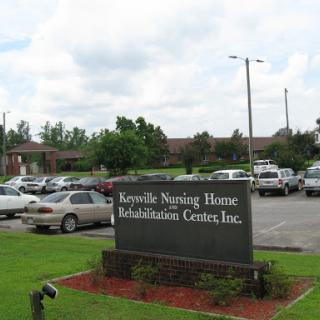 Exterior view of a nursing home and rehabilitation center.