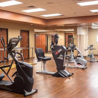 A well-equipped gym featuring various exercise machines for fitness enthusiasts.